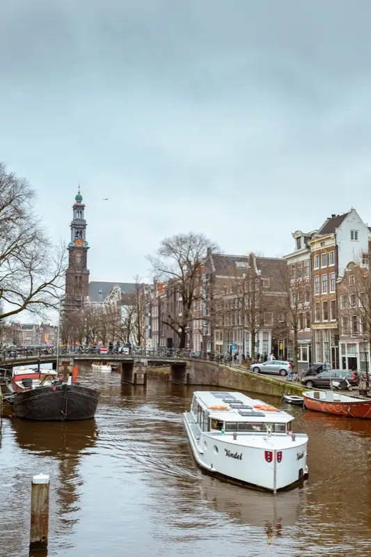 Westerkerk Church And Amsterdam Canal Prinsengracht in Amsterdam Netherlands with HelloRoam eSIM