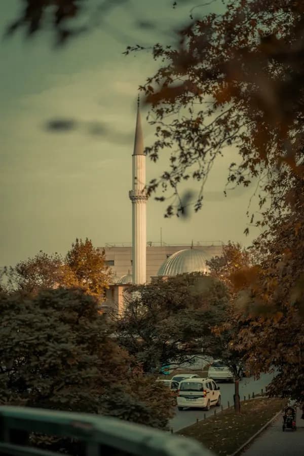 eSIM Bursa Turkey - Ottoman Grand Mosque minaret towering over the historic city center with Uludag mountain behind