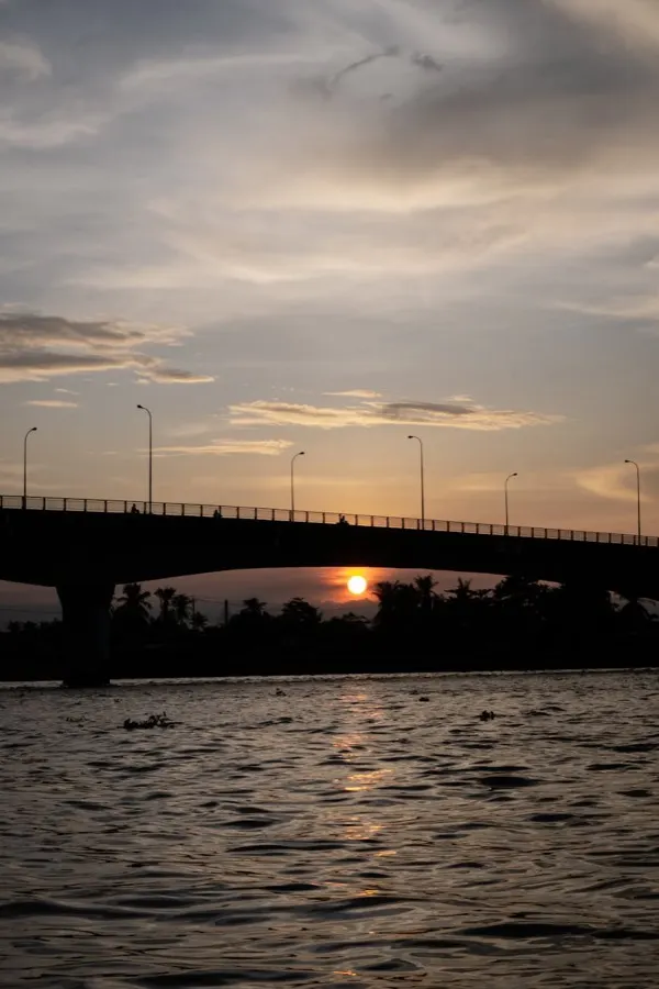 eSIM Can Tho Vietnam - Cai Rang floating market with wooden boats loaded with tropical fruits at dawn