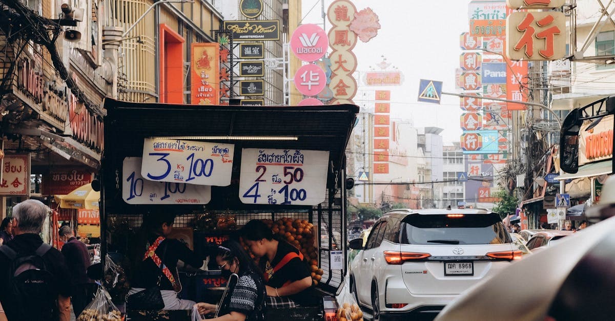 Bustling Bangkok street famous for its colourful signs and vibrant street food culture