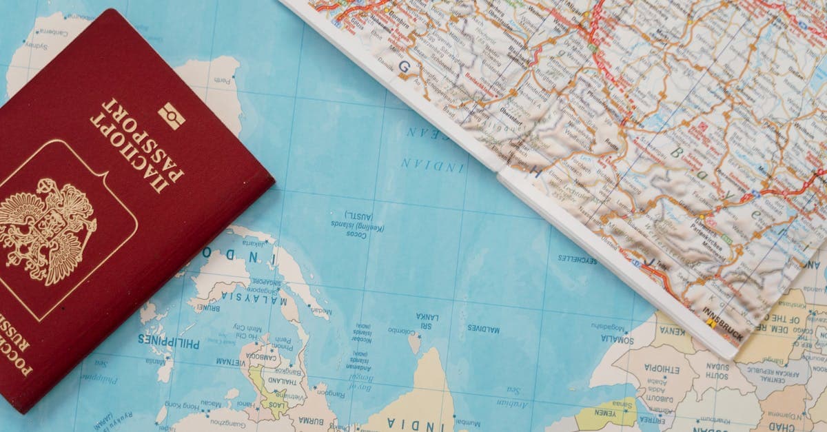 NZ passport and travel map laid out flat, essential items for planning a southeast asia visa-free journey