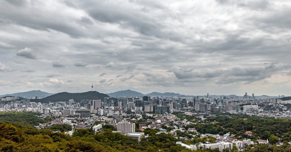 Seoul urban skyline under overcast skies during the changma monsoon season in summer