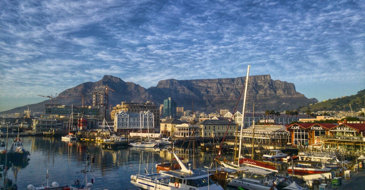 Cape Town harbour with iconic Table Mountain, a reminder to read crime coverage clauses in travel insurance