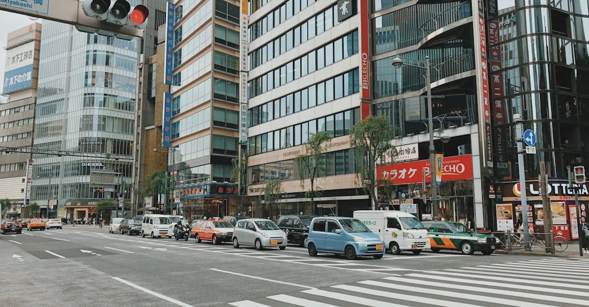 Busy pedestrian crossing in Tokyo featuring sleek architecture, a scene from every tokyo travel guide