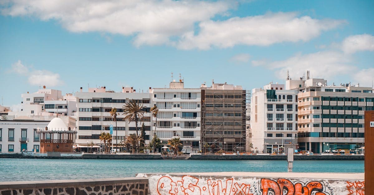 Colourful waterfront buildings and street art in Puerto del Carmen, Lanzarote, where to stay connected while travelling