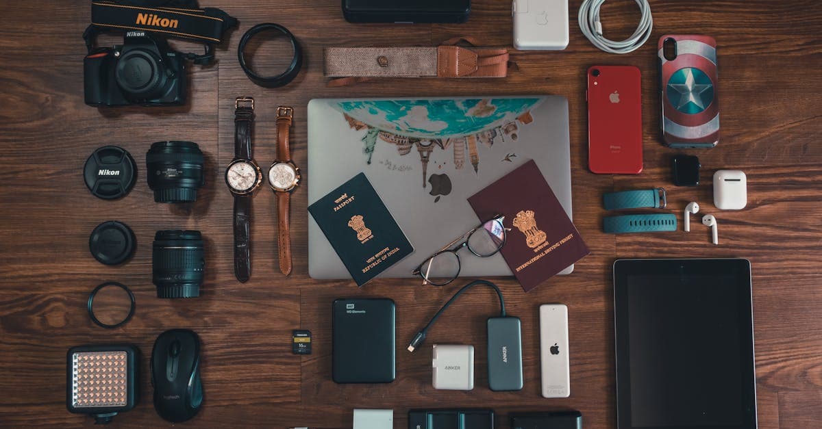 Flat lay of gadgets, passport, and camera as packing list travel essentials for New Zealand