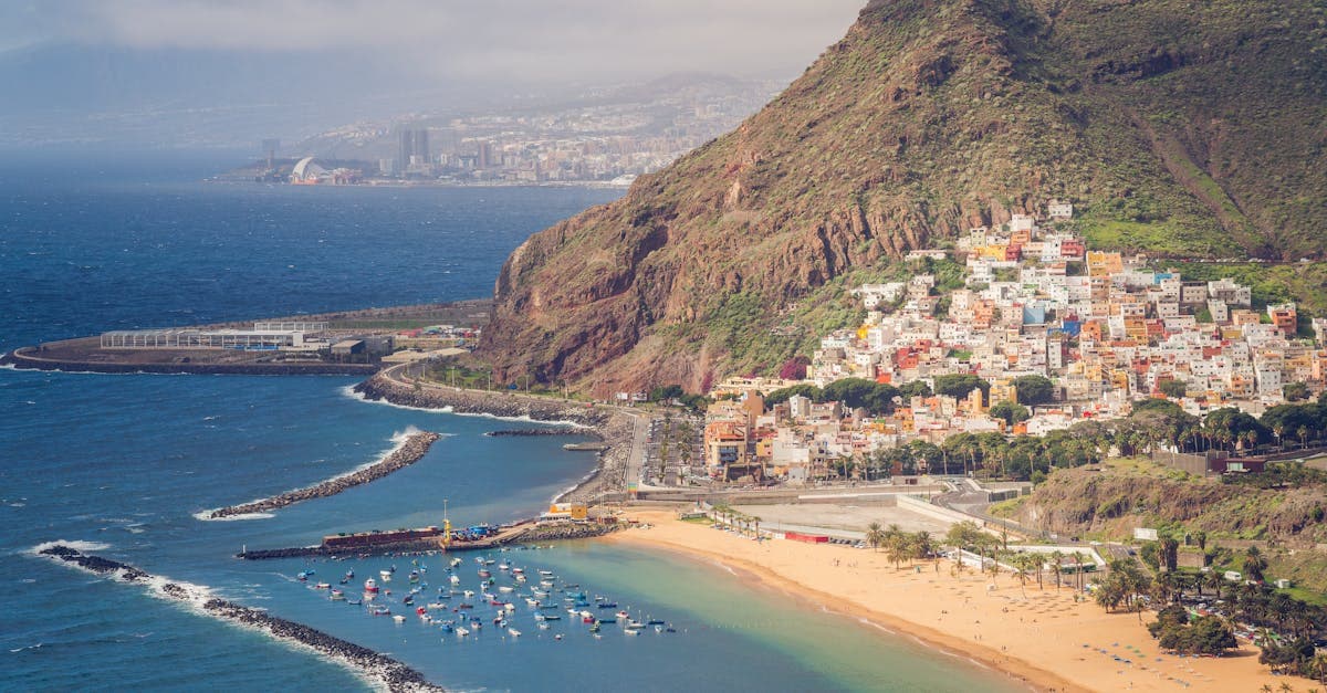 Tenerife's golden beach and coastal city from above, visible on direct flights from Irish airports year-round