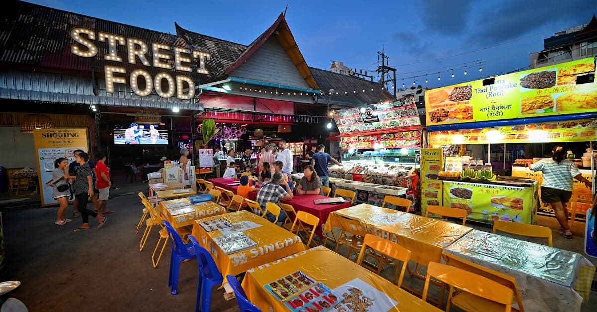 Colourful Patong night market in Phuket featuring diverse street food thailand stalls and bustling vendors.