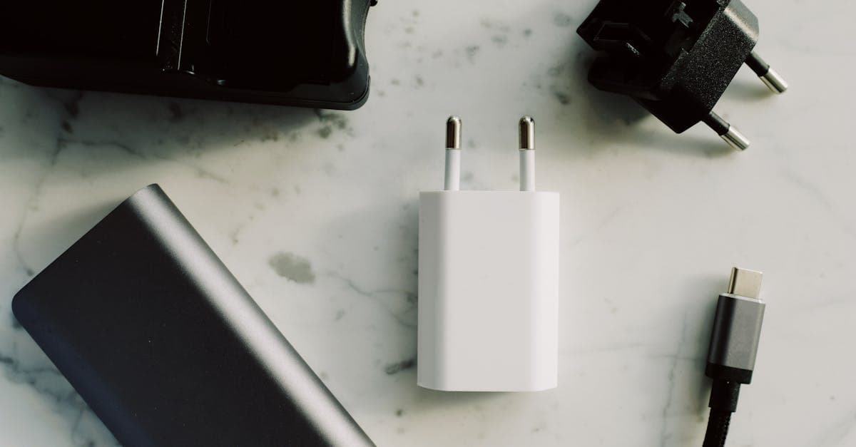 USB-C adapters and travel chargers on a marble surface, representing Europe roaming data costs
