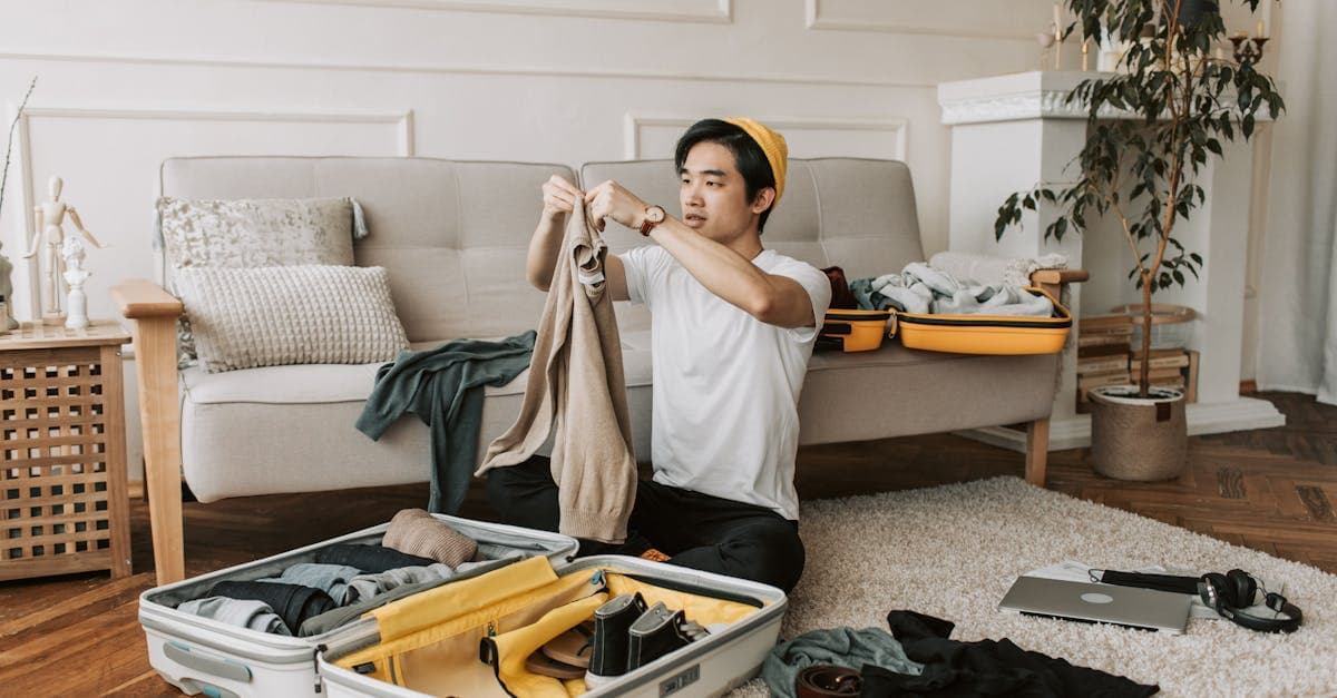 Irish traveller organising currency and clothing into a suitcase as part of their holiday packing list