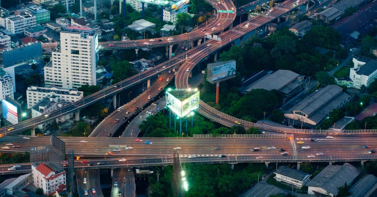 Aerial Bangkok expressway intersection lit at night, where knowing is thailand safe helps tourists avoid scams and crime