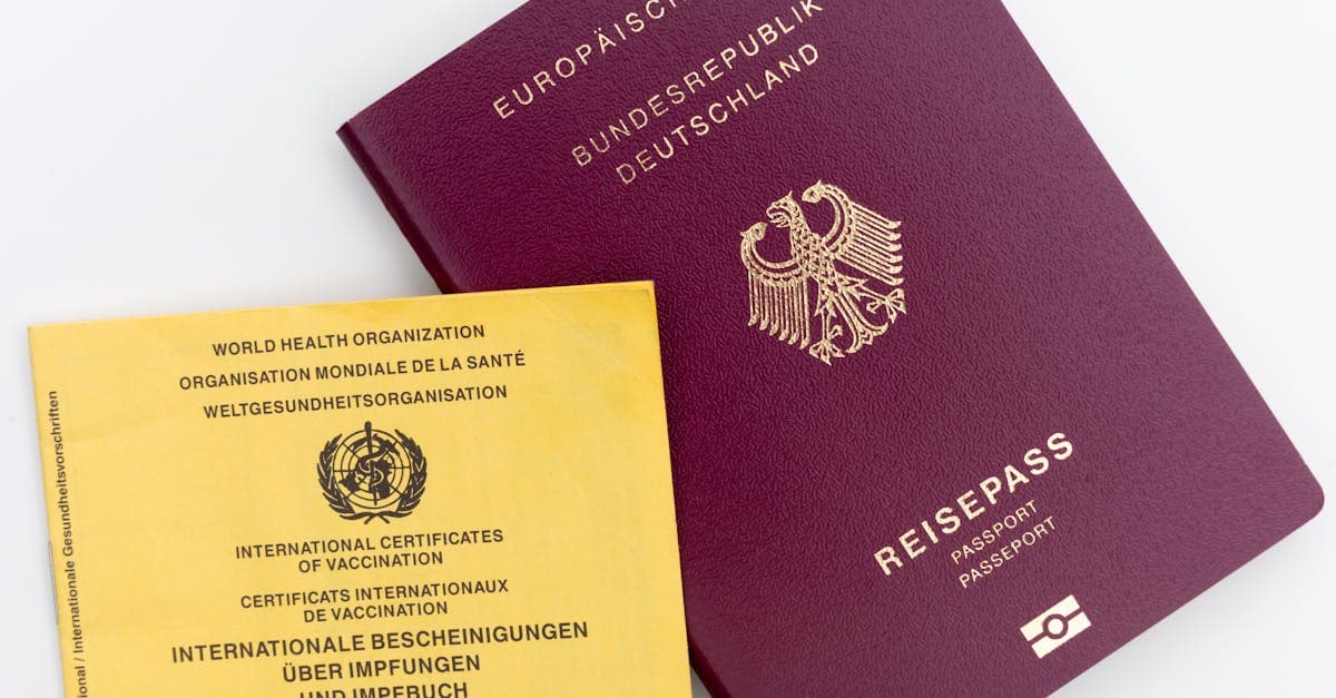 Close-up view of a German passport and WHO vaccination card, ideal for travel themes.