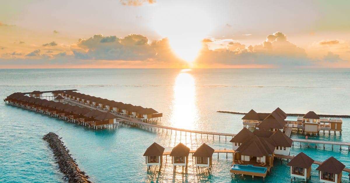 Maldives overwater villas at sunrise, representing one of the cheapest holiday destinations from Ireland in 2026