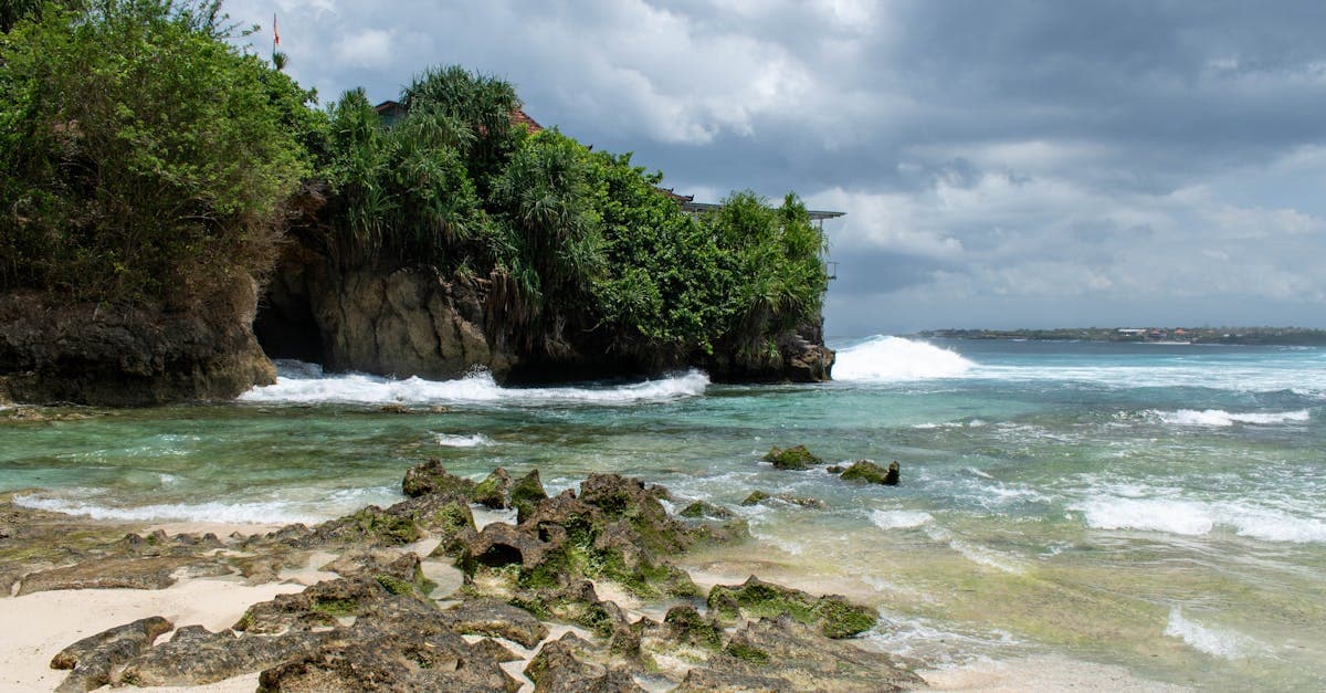 Padang Padang Beach with clear water and greenery showing current bali weather conditions and seasonal trends.