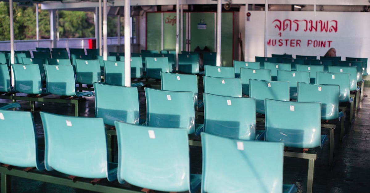 Emergency muster point seating area in southern Thailand where regional safety concerns differ significantly from northern regions.