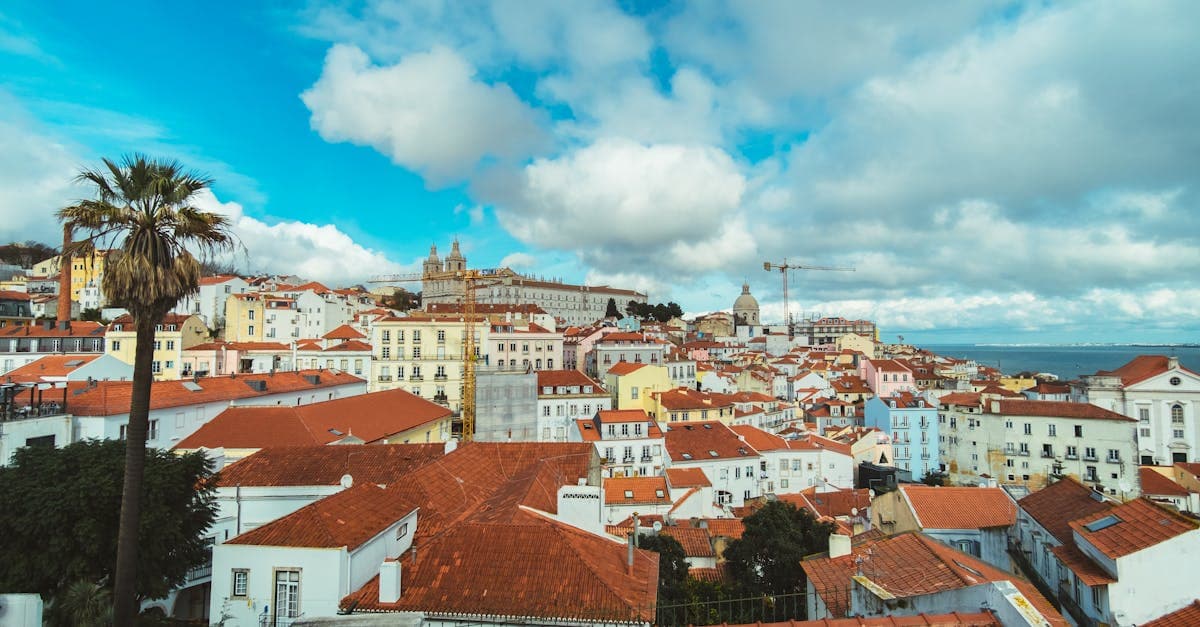 Lisbon's iconic red-roofed buildings where digital travel eSIM visa portugal holders must complete AIMA residency registration