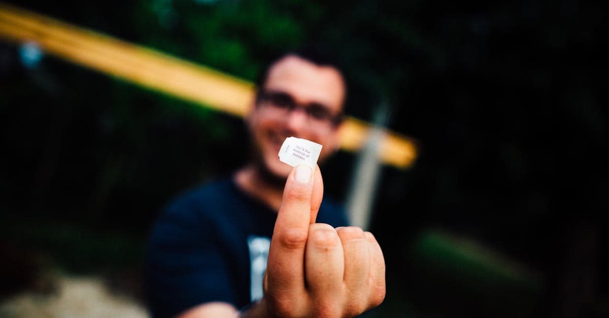 Traveller holding a travel sim card outdoors, deciding whether to buy connectivity in Singapore.