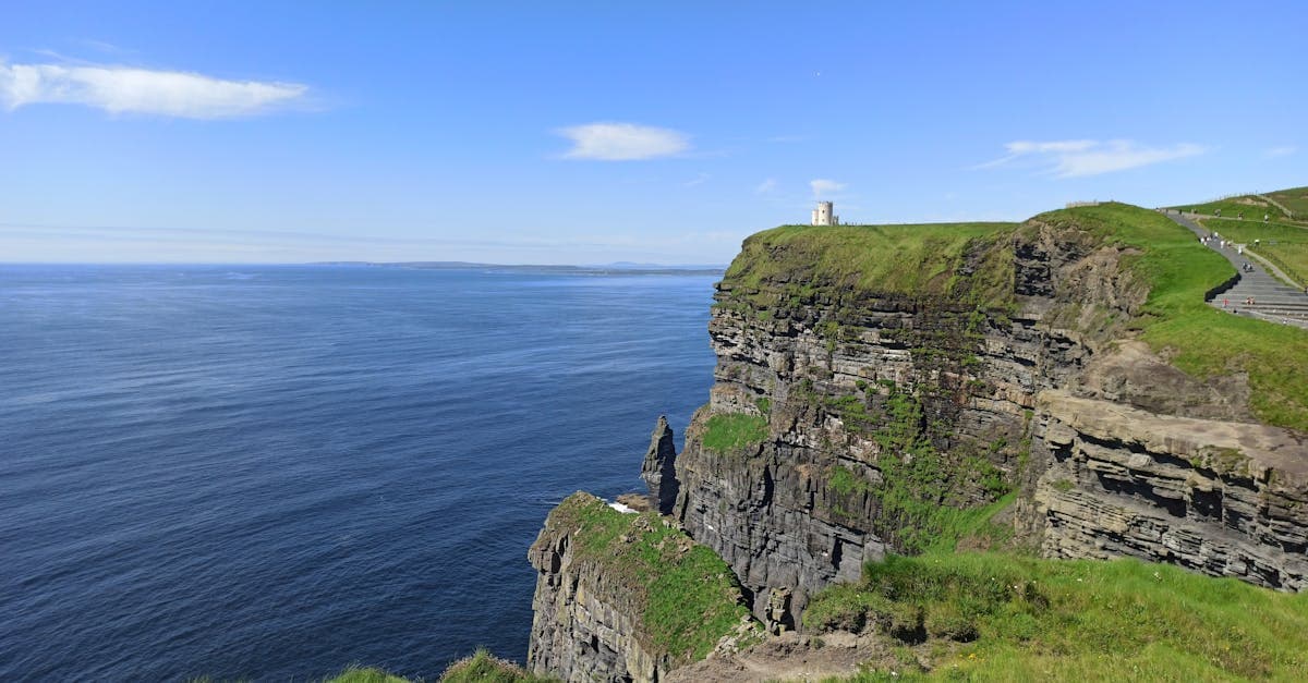Sunlit Cliffs of Moher overlooking the Atlantic Ocean, a remote spot where esim ireland coverage matters most.