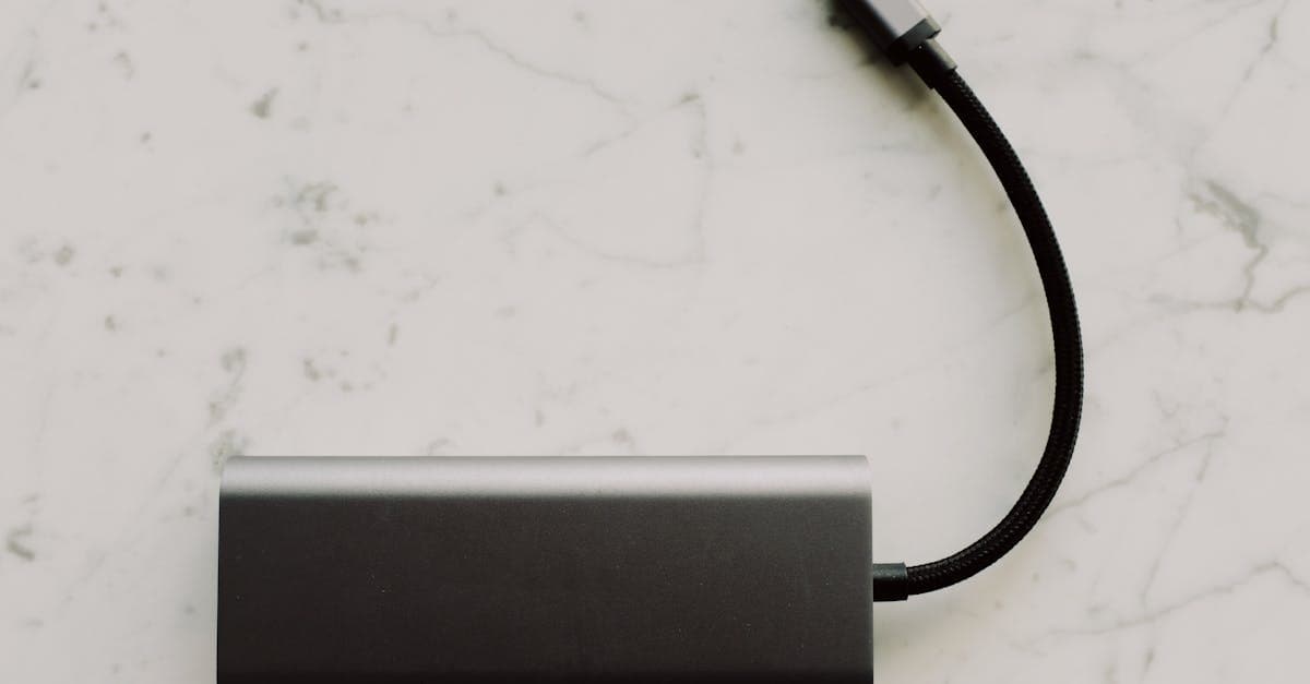 A travel-ready power bank on a marble surface, key for keeping portable wifi hotspots charged all day.