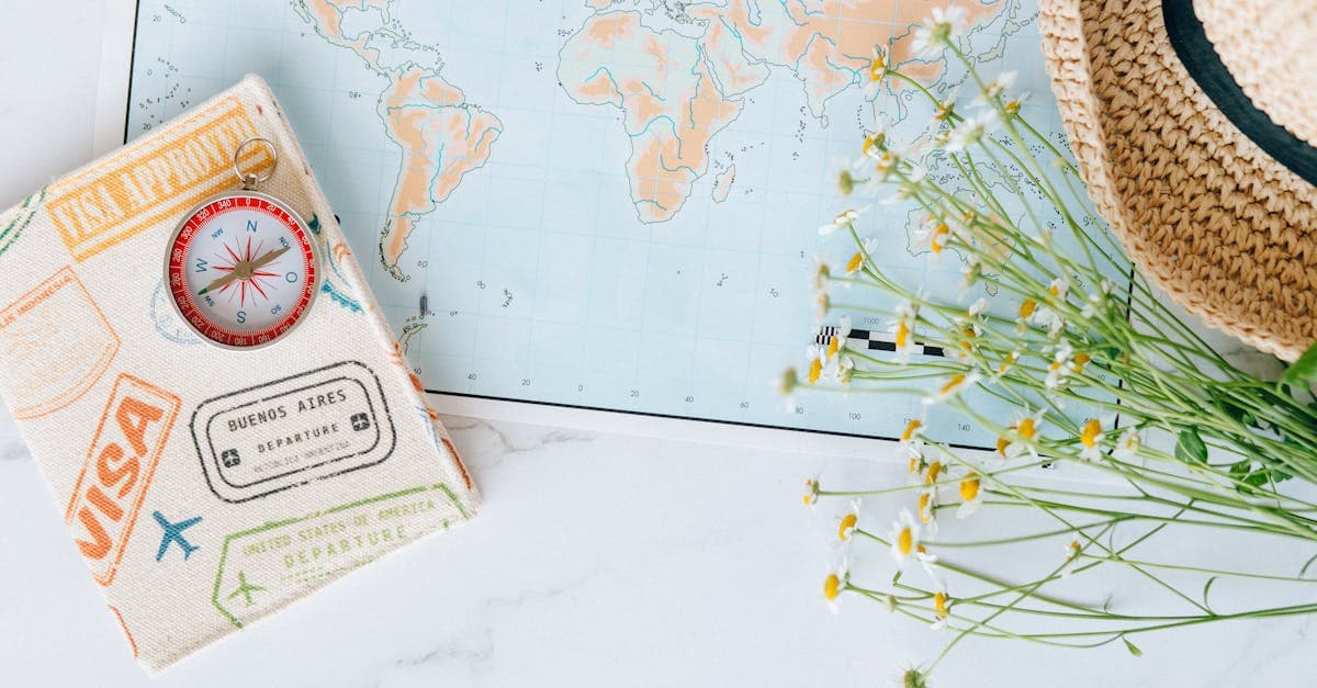 South African passport alongside a world map and compass for Schengen visa travel preparation