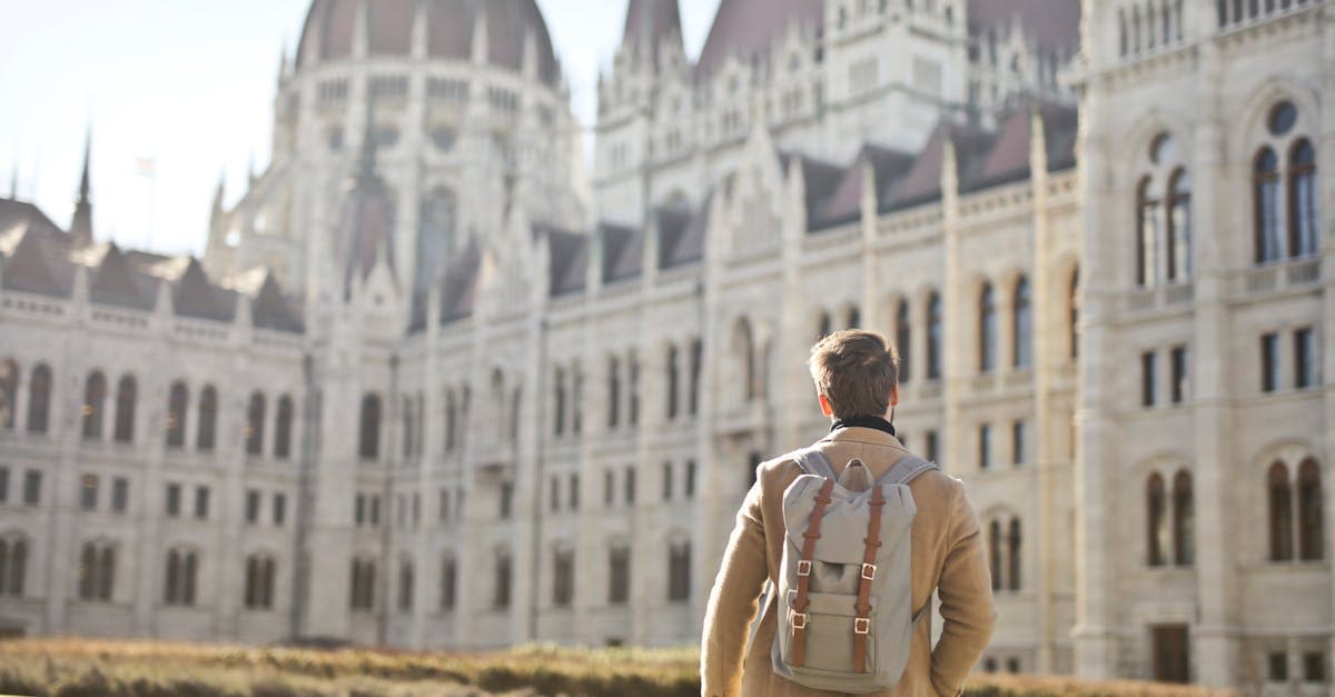 Tourist admiring Budapest Parliament Building, illustrating smart cost-cutting tips for budget travel europe from South Africa