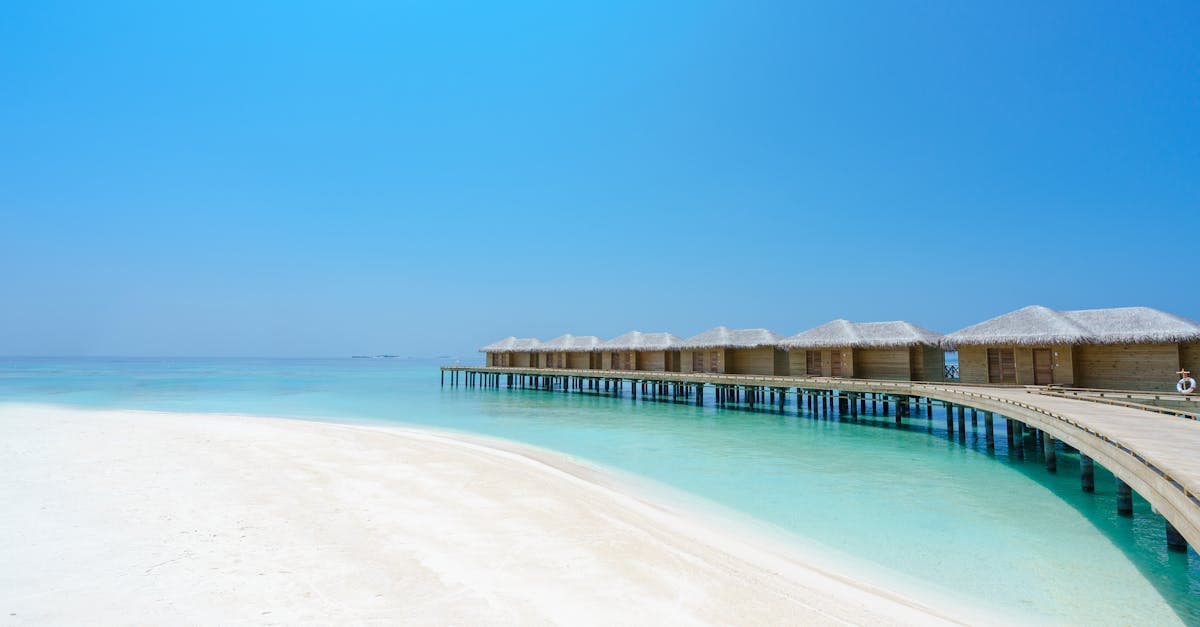 Overwater bungalows on a tropical Maldives lagoon representing the best time to visit maldives month by month