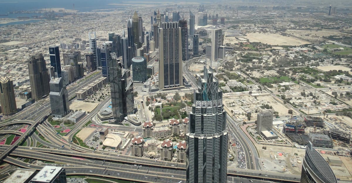Aerial view of Dubai's iconic skyscrapers and road network, helping budget travellers navigate the city affordably