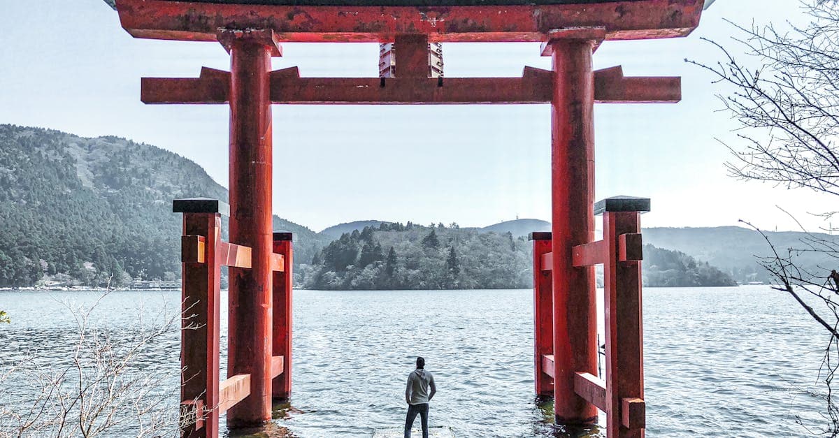 Hakone Shrine's iconic red torii gate rising from Lake Ashi, a serene stop on the japan itinerary