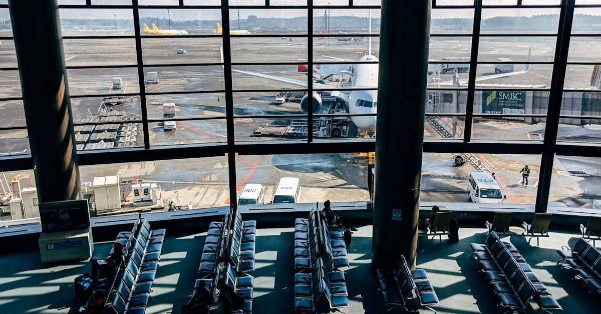 Spacious airport departure terminal with tarmac view, where Singapore travellers activate a travel eSIM before boarding to Japan