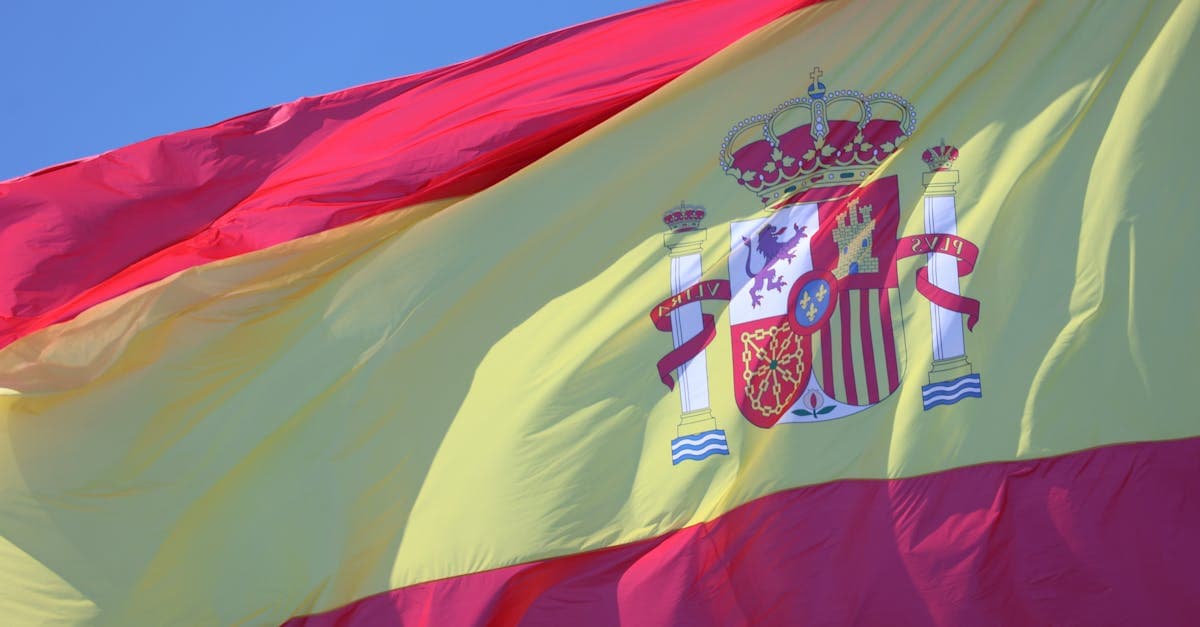 Spanish flag flying over Cádiz, Andalucía, symbolising the best esim spain options for Irish travellers in 2026