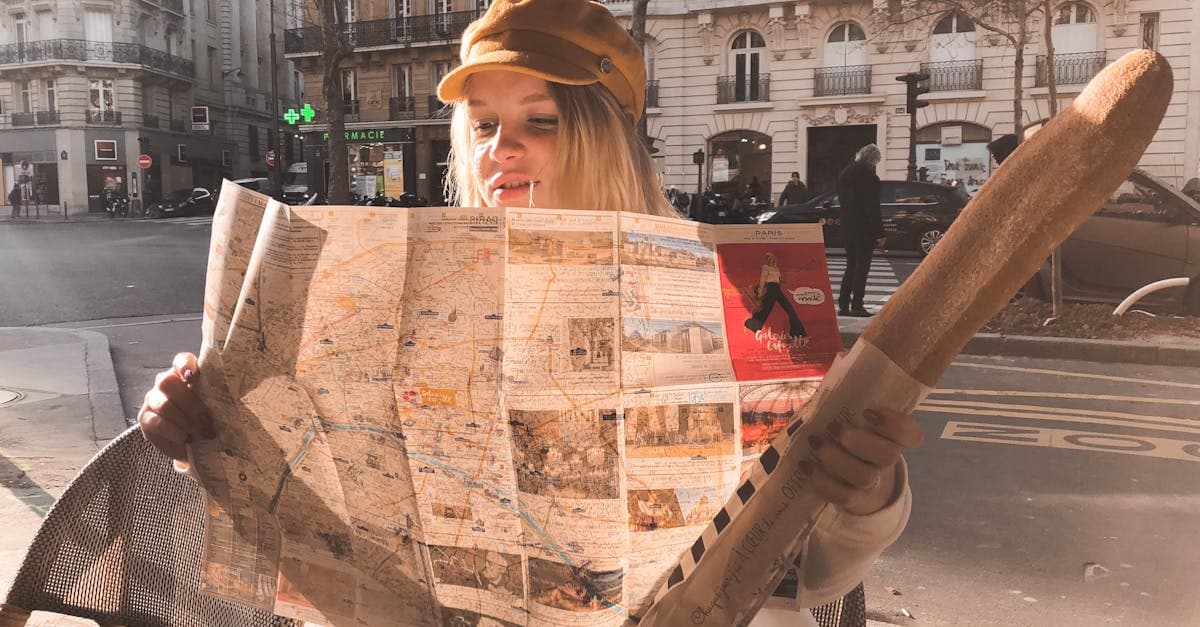 Woman with a baguette and map at a Parisian street cafe, embracing safe solo travel for women in Europe
