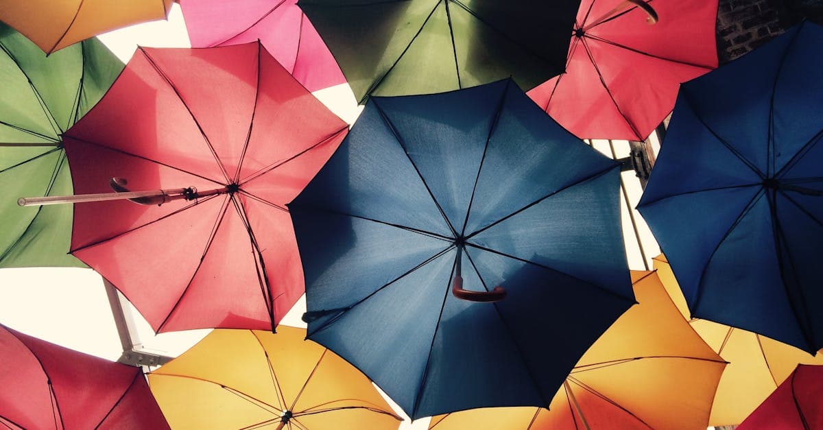 Colourful umbrellas over a London street, symbolising the broad protection offered by backpacker insurance