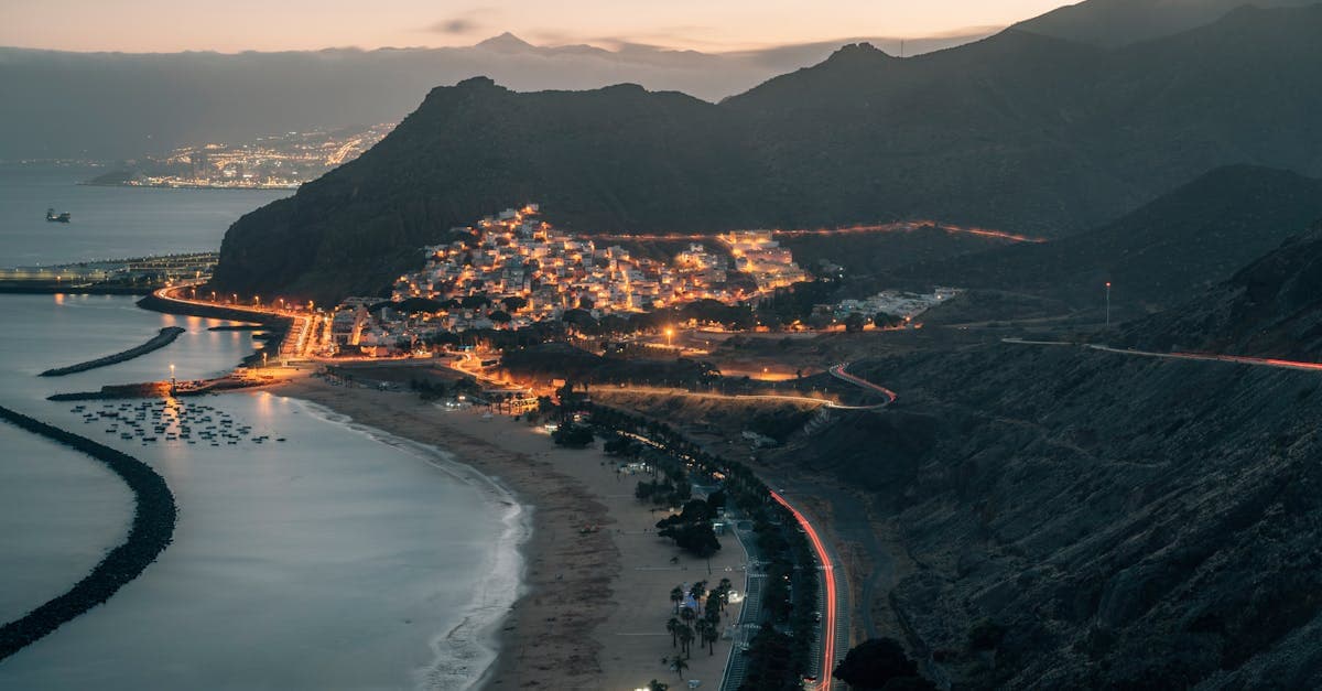 Tenerife coastal town glowing at dusk, showing how even the rainy season stays mild and welcoming for visitors