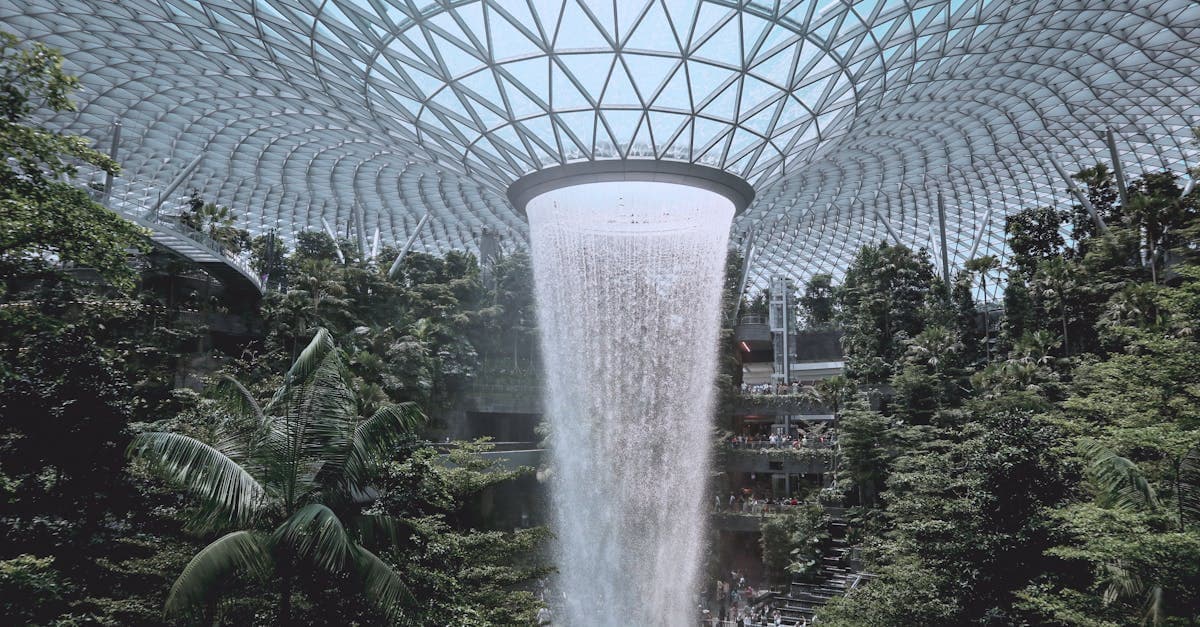 Jewel Changi Airport's iconic indoor waterfall, why travel insurance singapore is worth having before you arrive.