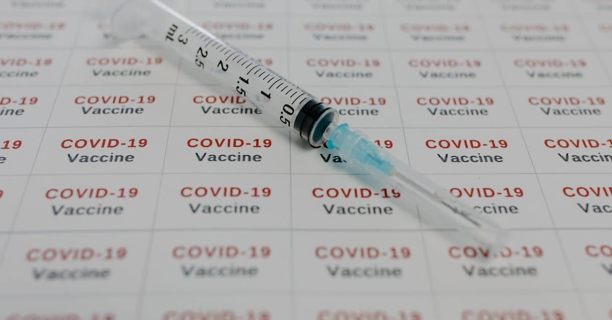 Medical syringe beside vaccine labels representing the cost of travel vaccinations and Irish tax relief