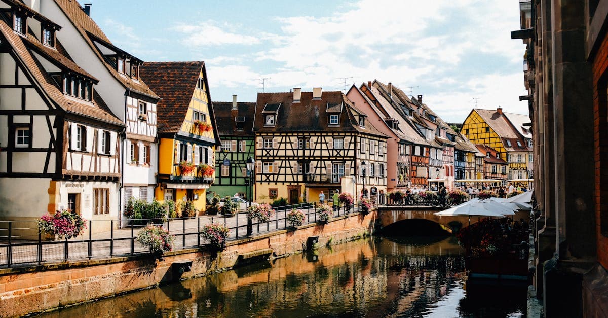 Scenic canal and historic half-timbered houses in Colmar, France, a top-value solo trip europe destination