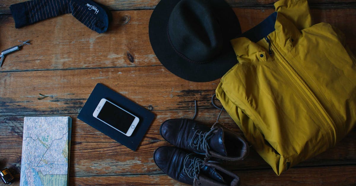 Flatlay of summer travel essentials on a wooden table, perfect for an Ireland packing list