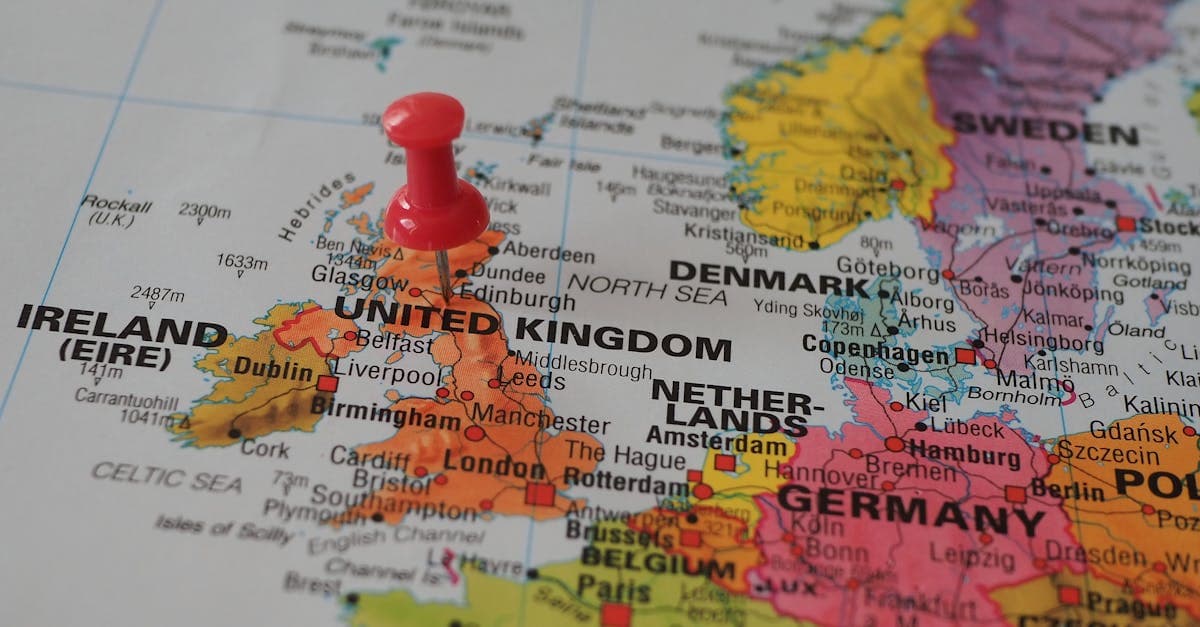 European map with red pin marking the UK whilst comparing options for the cheapest countries to visit.