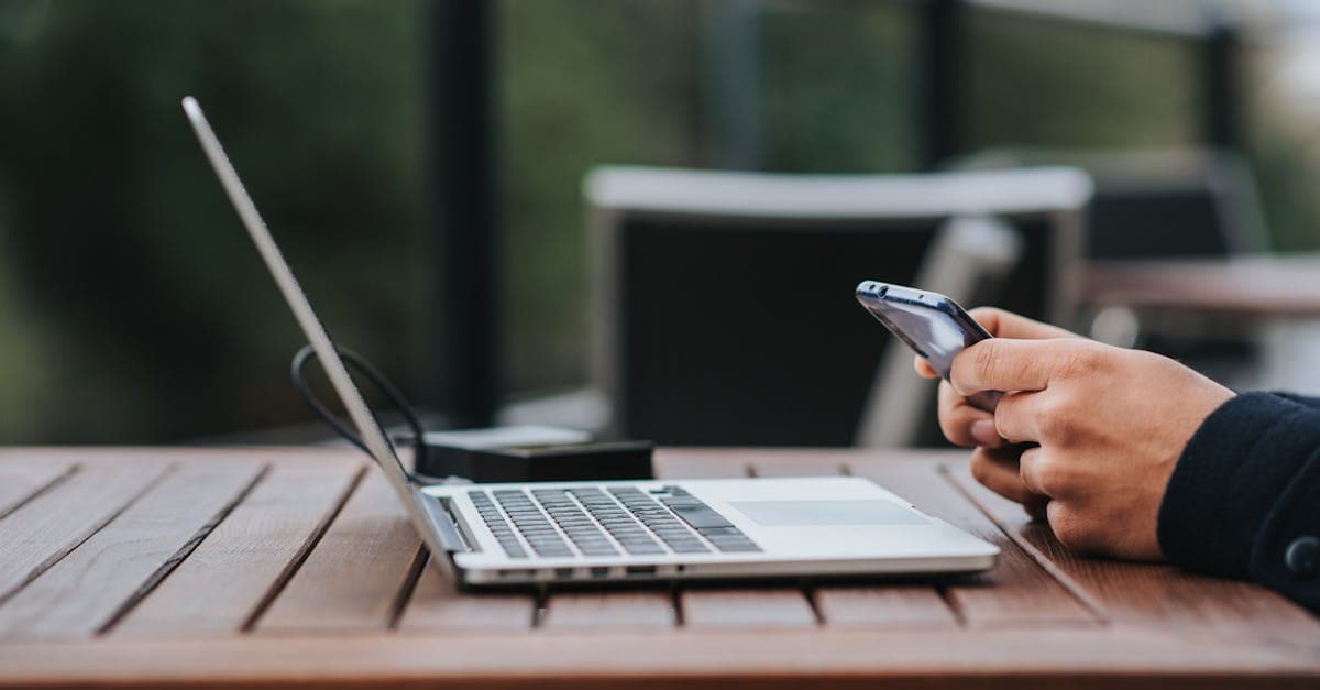 Traveller using smartphone and power bank at street cafe, connected via India's portable wifi hotspot