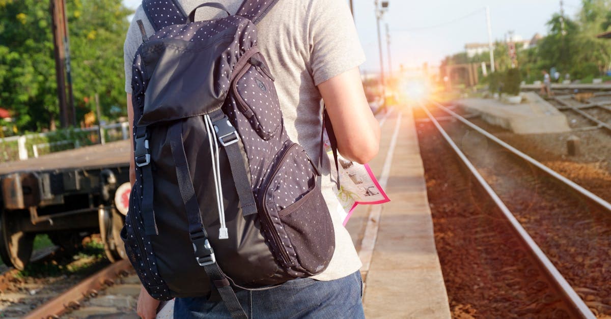 Solo backpacker at a railway station platform, following key traveling alone tips for India