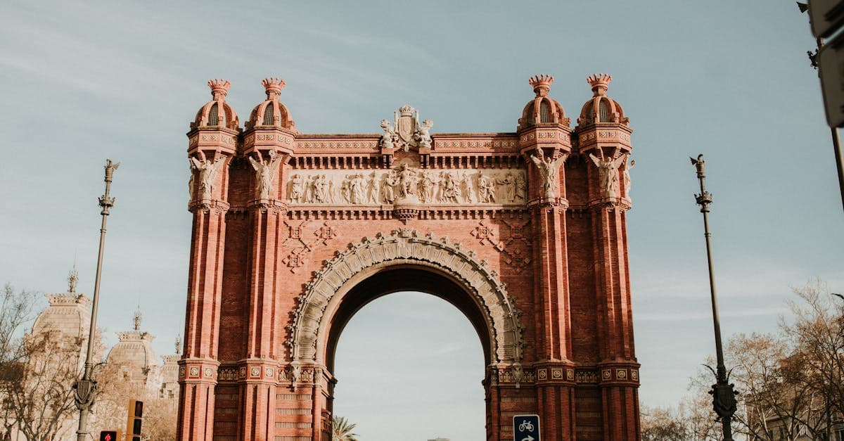 Arc de Triomf in Barcelona surrounded by tourists wondering whether they need an esim spain for their trip