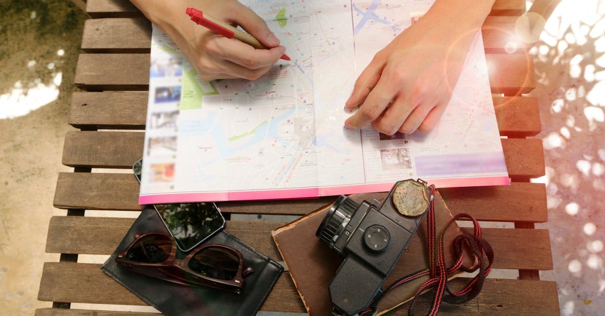 Person with vintage camera and map deciding what to include in a New Zealand itinerary template.