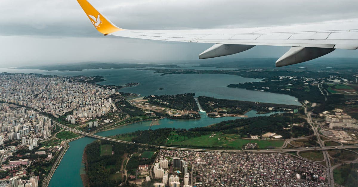Aerial view from budget airline window comparing Scoot and Jetstar Asia fares for cheap flights from Singapore.