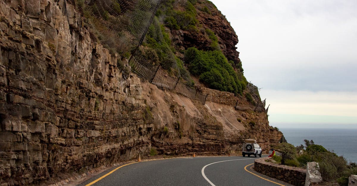 Winding Chapman's Peak road in Cape Town illustrating why you need the best travel insurance for Africa